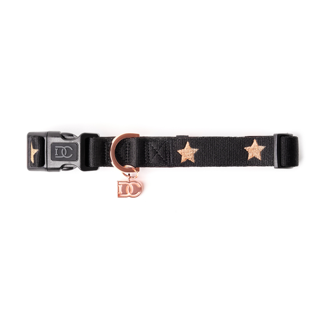 Stylish black pet collar with rose gold stars featuring matte rose gold DC logo charm #color_embroidered_rockstar